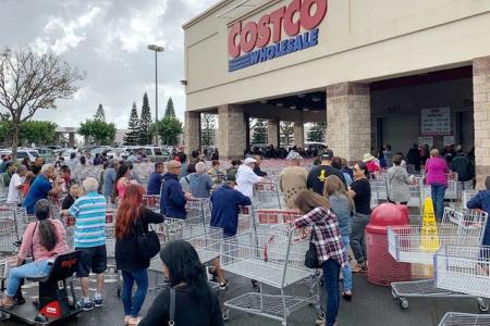 Shoppers say Costco stores were mobbed with customers stocking up over the weekend as panic over cor