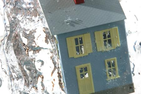 What are the Differences Between Sewer Water Backup and Flood Coverage in Property Insurance?